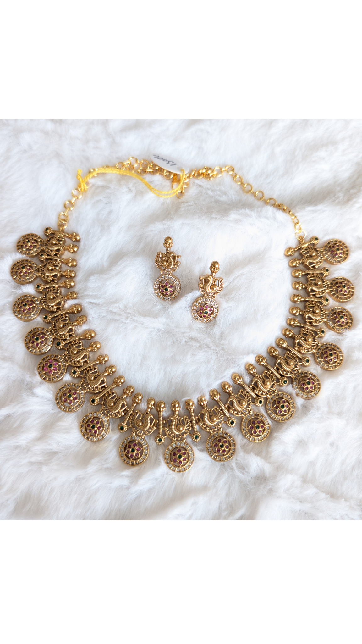 Gold necklace and earrings set.
