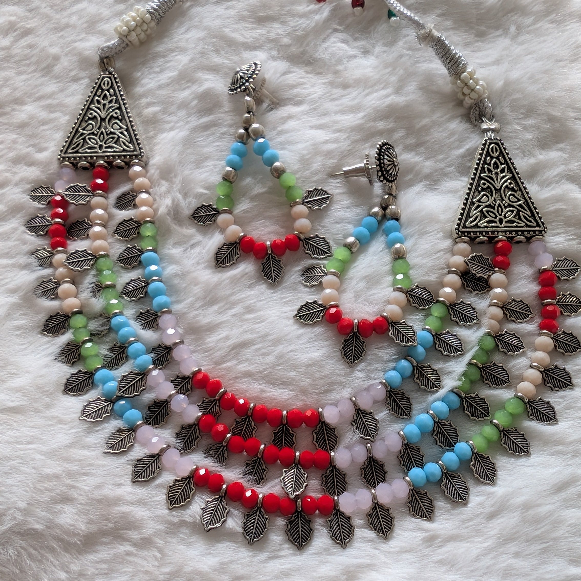 Colorful beaded necklace and earrings.